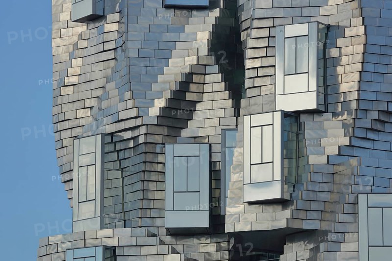 Roof with window of the modern building Tour Luma 56m high by architect Frank Gehry 2021, silver roof and bizarre spire, bizarre, shiny, modernism, deconstructivism, detail, Arles, Bouches-du-Rhône, Camargue, Provence, France