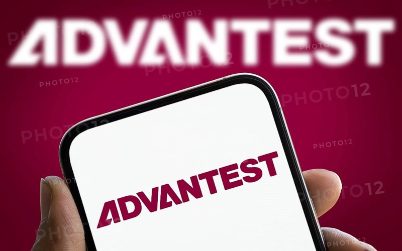 Advantest logo is displayed on smartphone. Advantest Corporation is a leading Japanese manufacturer of automated test equipment for the semiconductor industry