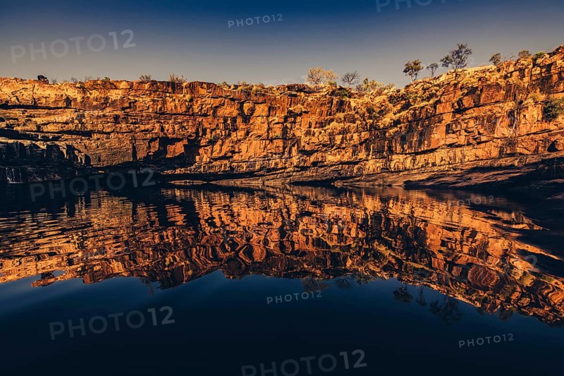 Bell Gorge waterfall, a body of water in north-west Australia in the Kimberley. Sunrise in the outback, Australia