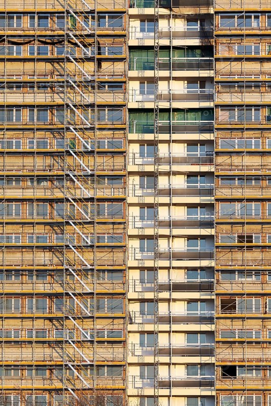 Scaffolded high-rise building from the 1970s, refurbishment in the Hochheide residential park, white giants, derelict properties, Duisburg, North Rhine-Westphalia, Germany