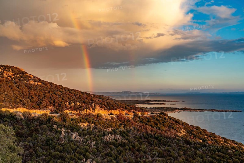Rainbow over the southwest coast of Corsica, France