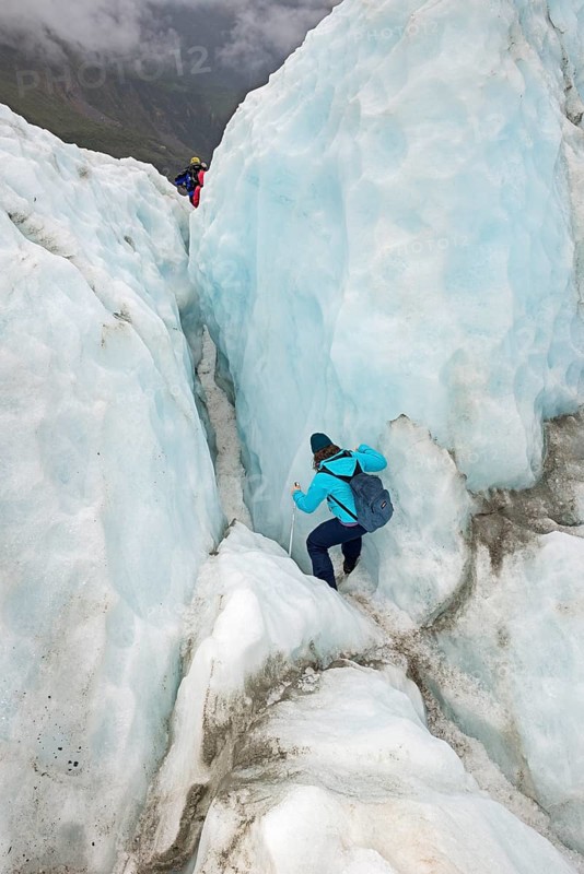 Mountaineer on glacier, Fox Glacier, Westland National Park, South Island, New Zealand
