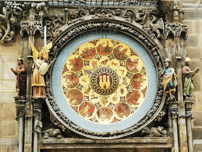 Detailed astronomical clock at Prague City Hall with Gothic sculptures and medieval art style, Prague