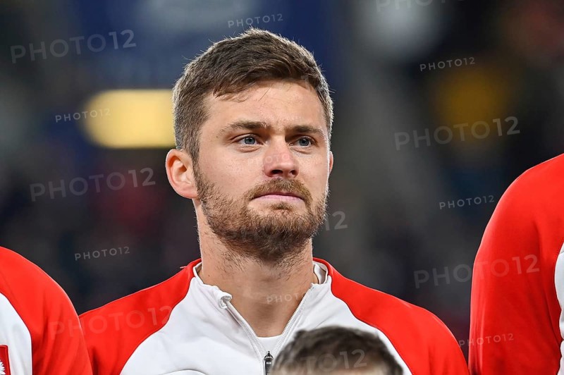 PRAGUE, CZECH REPUBLIC - MARCH 24, 2023: Qualifications for UEFA Euro 2024. Match Czech Republic - Poland 3:1. Karol Linetty during anthem.