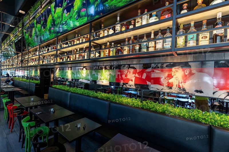 Fort Lauderdale restaurant bar with a variety of wine and liquor bottles and glasses on the shelves