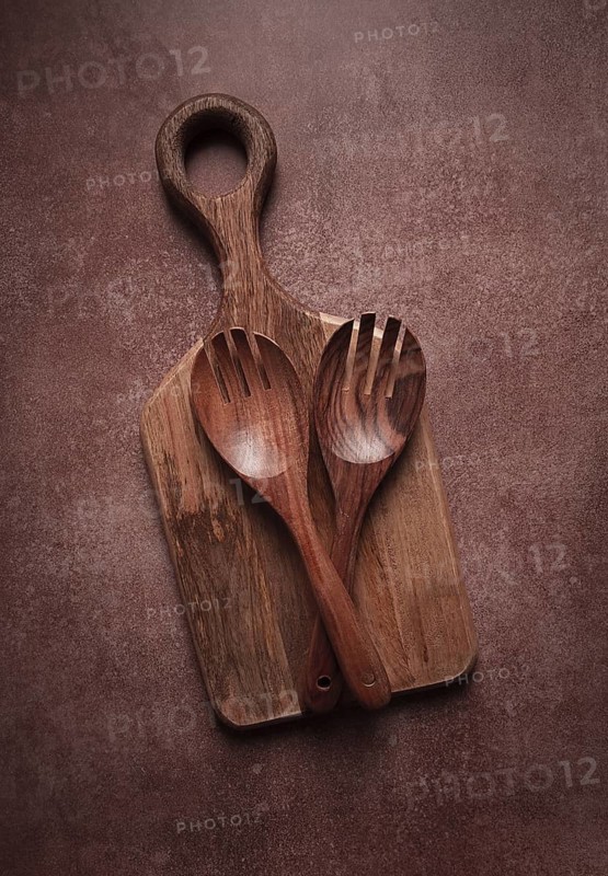 Wooden spoon, with cloves, for salad, two pieces, natural wood, with cutting board, food background, wallpaper, top view