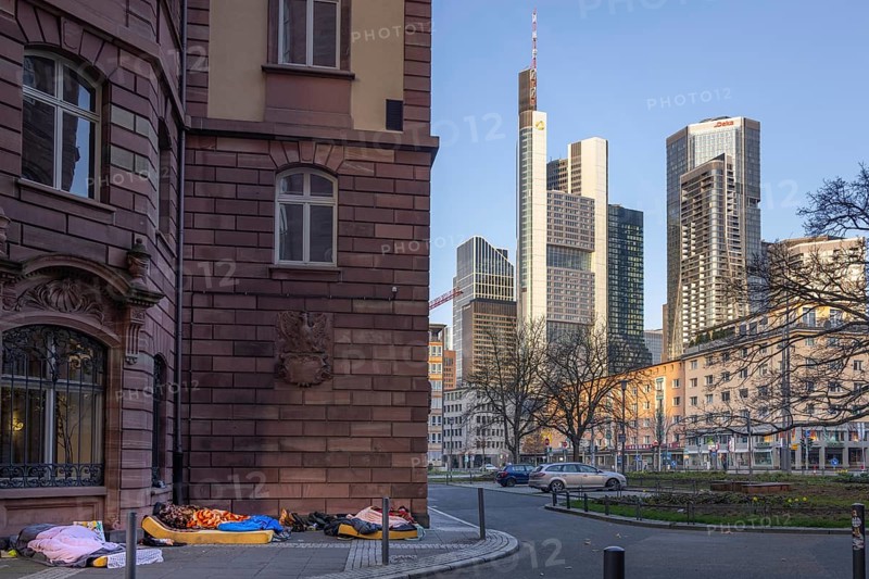 Several homeless people sleep in the morning near St. Paul's Church at the foot of Frankfurt's banking skyline. An unresolved problem is the steadily increasing number of people living in Frankfurt am Main in the open air, Frankfurt am Main, Hesse, Germany