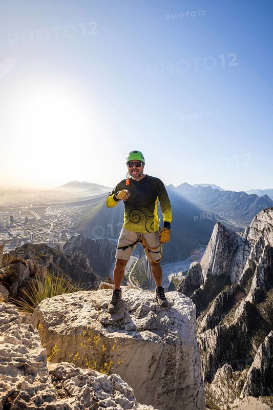 Man skillfully navigates the rugged terrain of Eagleâ€™s Nest in Mexico, capturing the thrill of mountaineering against a backdrop of breathtaking vistas and jagged peaks
