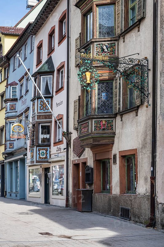 Historic town houses with artfully decorated bay windows and traditional guild signs, signs in Hochbrücktorstraße, historic old town of Rottweil, Rottweil district, Baden-Württemberg, Germany