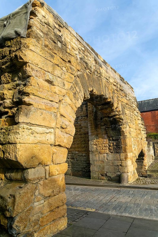 Newport Arch on Ermine Street, Roman entrance gateway to city of Lincoln, Lincolnshire, England, UK