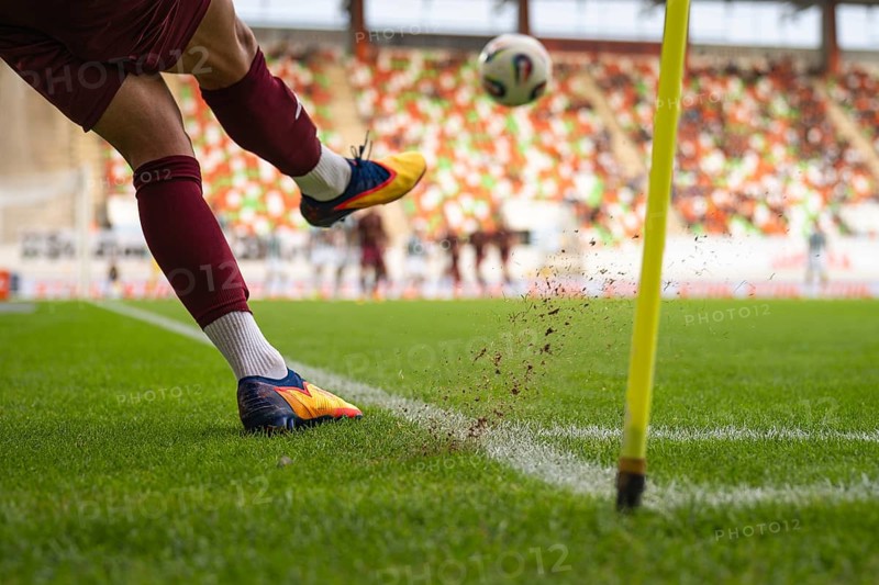 Player kicks the ball from the corner during the soccer match in Lubin, Poland