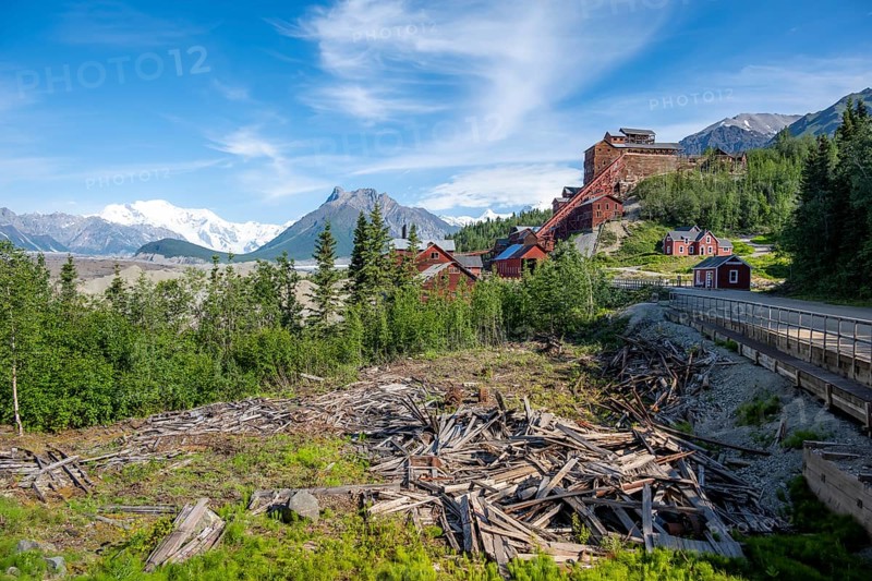 Red Kennicott buildings in front of mountainous landscape, Kennicott Concentration Mill to extract copper from quarried rock, Historic Kennecott Copper Mine, National Historic Landmark, Wrangell St. Elias National Park, Alaska, USA