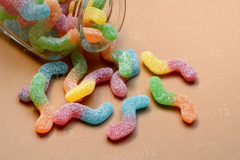 Lots of colorful jelly sweets with glass containers