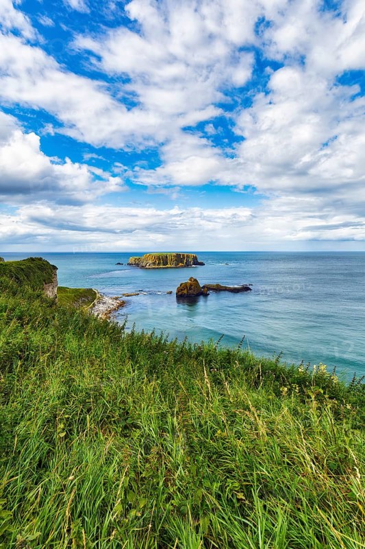 Rocky island off the coast, coastline, coastline between Ballycastle and Ballintoy, Causeway Coastal Route, Antrim, Northern Ireland, Great Britain
