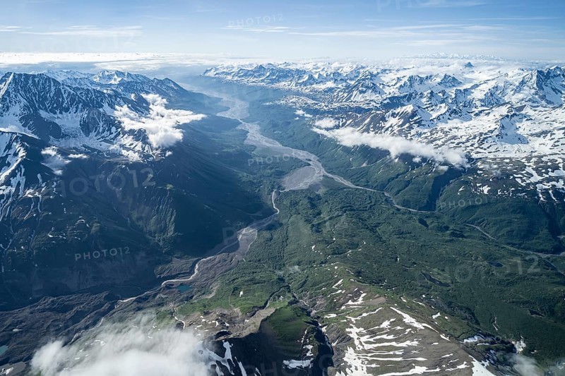 Mountain valley with river, snow and ice, epic mountains with glaciers, aerial view, Alaska Range, Denali National Park, Alaska, USA
