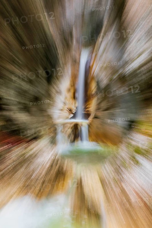 Waterfall with zoom effect Heckenbach waterfall, The dripping eye of nature, Kochel am See, Bavaria, Germany