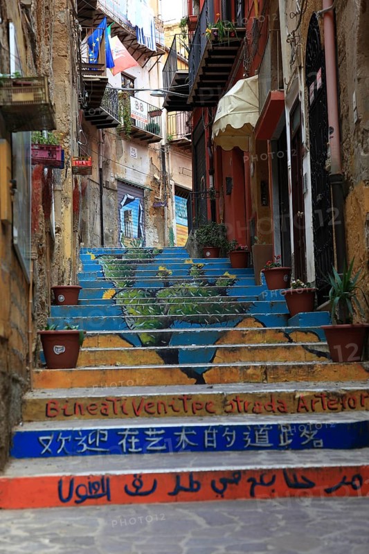 In the old town of Agrigento, Agrigento, colourful staircase in a narrow alley, alleyway art, Sicily, Italy