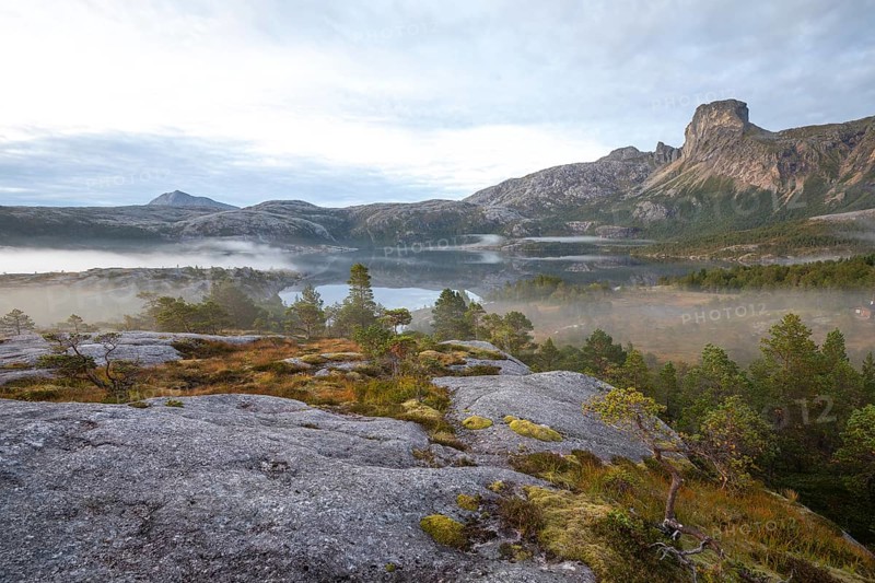 Magical morning fog on Steigtindvatnet in front of the majestic Steigtinden in Norway near Bodø