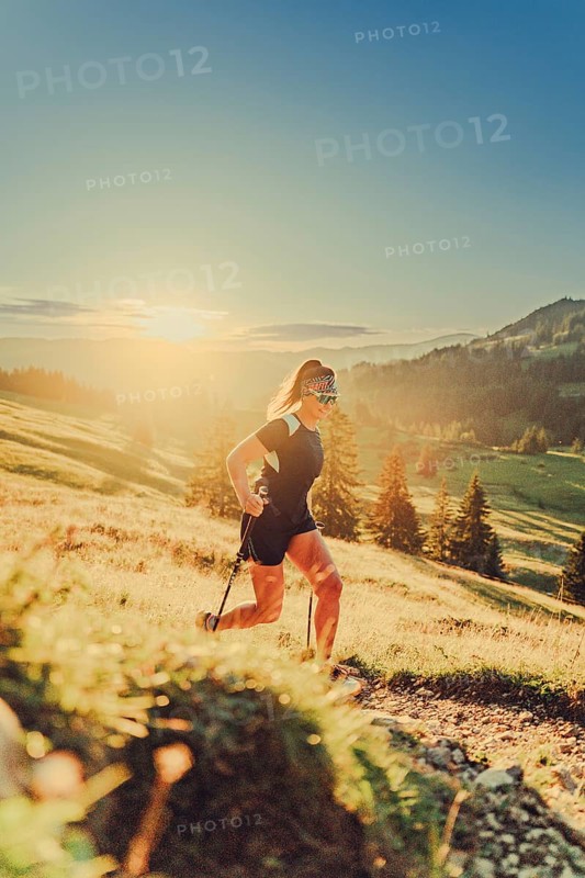 Summer trail running and hiking in the Alps on the Riedberg Pass between Obermaiselstein and Balderschwang in the Allgäu, Bavaria, Germany