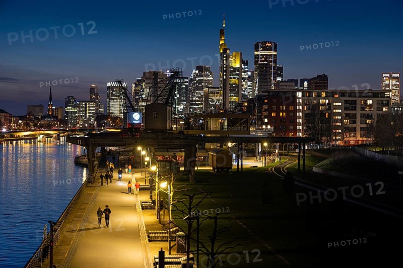 The lights of Frankfurt's banking skyline glow in the evening, Frankfurt am Main, Hesse, Germany