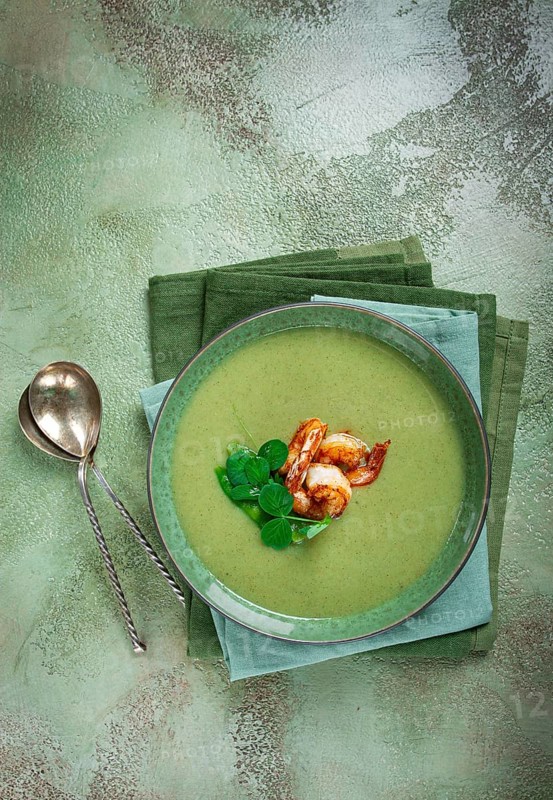 Pea cream soup, with shrimp, green soup, homemade, top view, no people