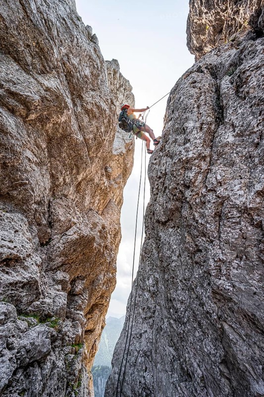 Climber on a climbing tour, abseiling, alpine climbing, crossing the Kampenwand, Chiemgau, Bavaria, Germany