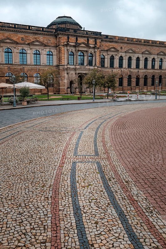 The stunning Zwinger Palace in Dresden, Germany, showcases Baroque architecture with its grand facade and intricate stonework, offering a glimpse into elegant historical design