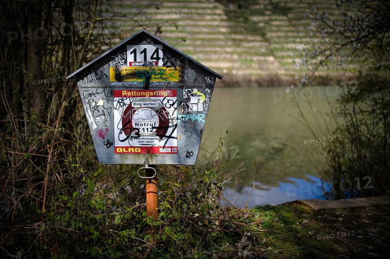 Graffiti, vandalism, lifebuoy, Max-Eyth-See, Hofen, behind Neckar, Stuttgart, Baden-Württemberg, Germany