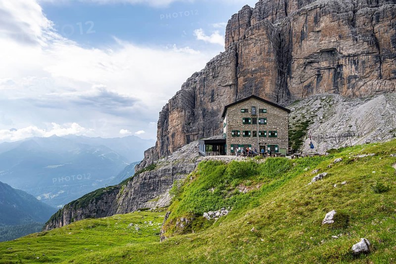 Rifugio Maria E Alberto Ai Brentai mountain hut and rocky peak, Brenta, Trentino, Italy