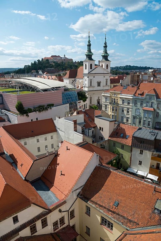 Urban scene with a mixture of traditional church towers and modern architecture, view of St Michael's Church, in the background the medieval fortress Spielberg, Hrad Špilberk, Brno, Brno, Jihomoravský kraj, Moravia, Czech Republic