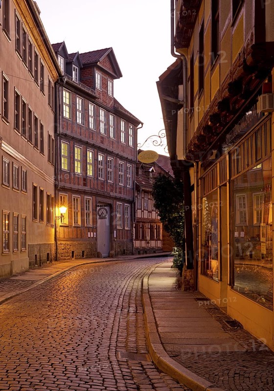 Half-timbered houses in a narrow street with cobblestones, Old Town in the evening, World Heritage City of Quedlinburg, Saxony-Anhalt, Germany