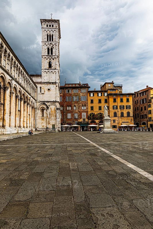 Dark rain clouds over the bell tower of the church of San Michele in Foro, historic city centre, Lucca, Tuscany, Italy