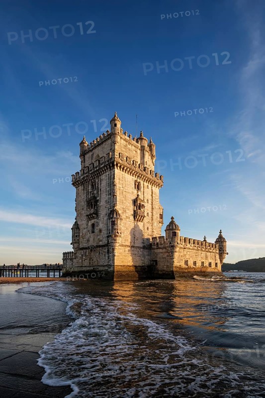 Belem Tower or Tower of St Vincent, famous tourist landmark of Lisboa and tourism attraction, on the bank of the Tagus River Tejo on sunset. Lisbon, Portugal