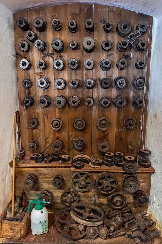 Tuchmachermuseum Bramsche, Lower Saxony, Germany, wall full of cogwheels of different sizes and shapes