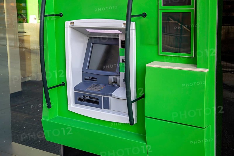 ATM banking machine in financial city business center ready for electronic money withdrawal