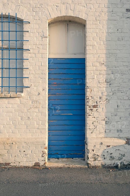 Detailed view of an old blue weathered long hall door in the evening light, Bremerhaven, Bremen, Germany