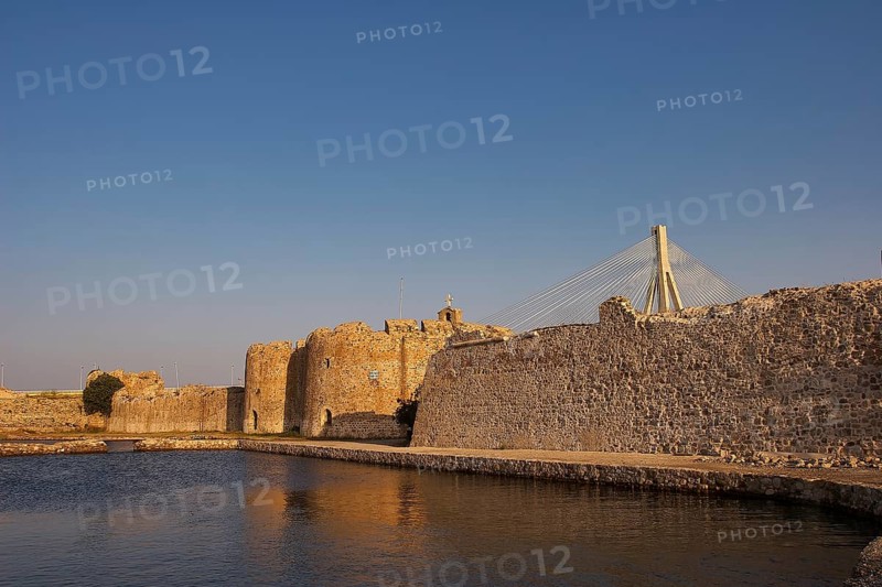 Historic fortress wall with modern bridge in the background, Rio-Antirrio cable car bridge, Rio fortress, Patras, Peloponnese, Greece