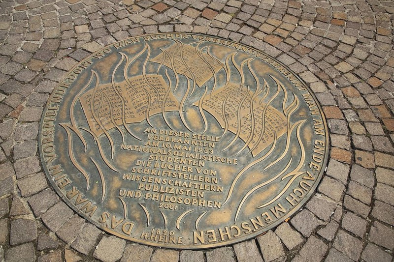 Round memorial plaque on book burning during Nazi era, destruction by flames and fire, Holocaust, memorial, flames, fire, National Socialism, books, paving stones, soil, inscription, Romans, Frankfurt am Main, Hesse, Germany