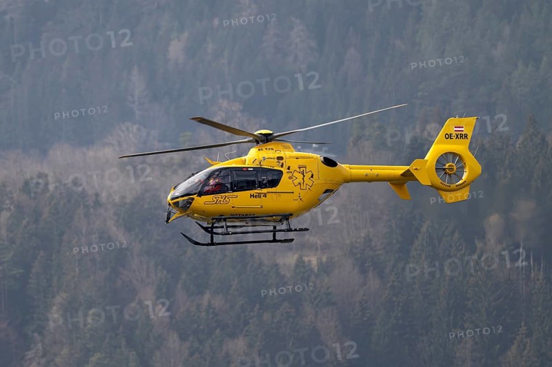 Rescue helicopter, emergency helicopter in flight, Schwaz, Tyrol, Austria