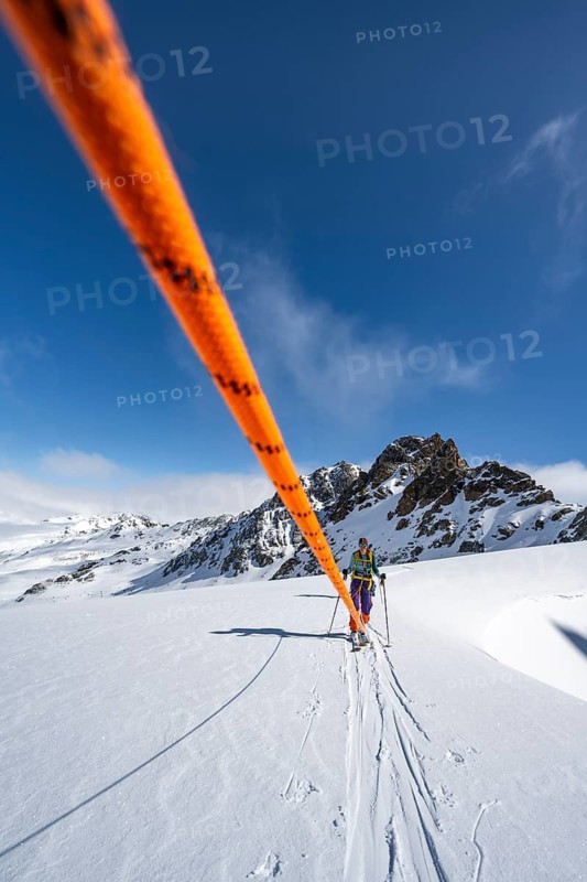 Ski tourer with rope, rope team on the Vadret da Porchabella glacier on the ascent to the summit of Piz Kesch, mountain landscape in winter, alpine tour, ski tour Bündner Haute Route, Albula Alps, Rhaetian Alps, Grisons, Eastern Switzerland, Switzerland