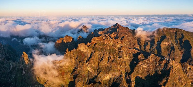 Aerial view, sunrise at Pico do Arieiro, clouds of fog sweeping over mountain peaks, Madeira, Portugal