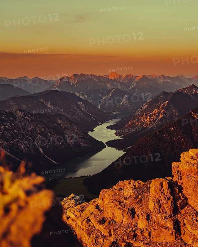 Thaneller summit at sunset in the Lechtal valley in Tyrol with a wonderful view of the surrounding mountains. Tyrol, Austria