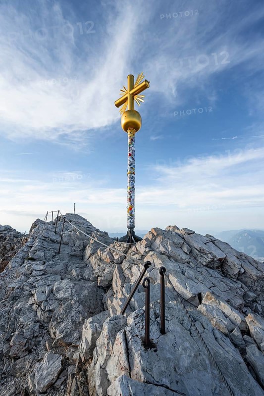 Golden summit cross on the summit of the Zugspitze, Wetterstein range, Bavaria, Germany