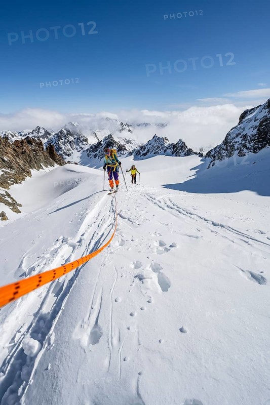 Ski tourer with rope, rope team on the Vadret da Porchabella glacier on the ascent to the summit of Piz Kesch, mountain landscape in winter, alpine tour, ski tour Bündner Haute Route, Albula Alps, Rhaetian Alps, Grisons, Eastern Switzerland, Switzerland