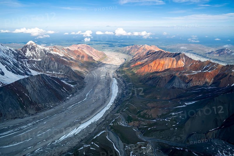 Glacier bed and colored mountains, aerial view, Alaska Range, Denali National Park, Alaska, USA