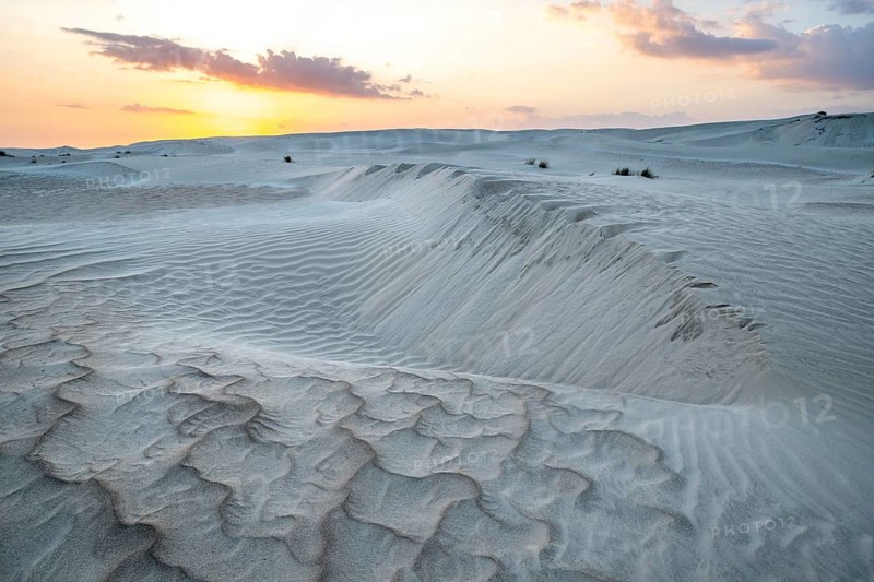 Sunset, white sand dunes in the Khaluf desert, Oman