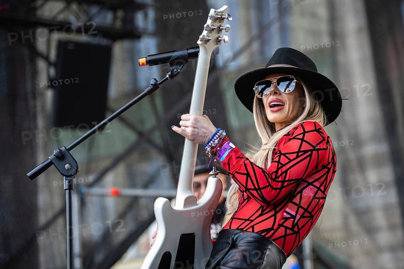 WROCLAW, POLAND - MAY 1, 2025: World Guitar Record concert, 8122 participants played Jimi Hendrix's song Hey Joe on guitars in the Wroclaw market square. Woman guitarist Orianthi