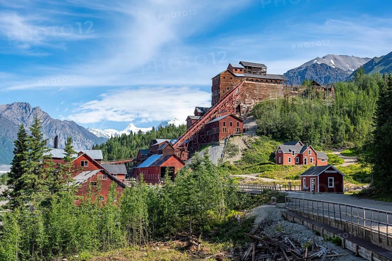 Red Kennicott buildings in front of mountainous landscape, Kennicott Concentration Mill to extract copper from quarried rock, Historic Kennecott Copper Mine, National Historic Landmark, Wrangell St. Elias National Park, Alaska, USA