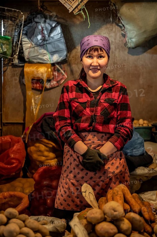 Vendor selling potatoes, stall, Osh Bazaar, Bishkek, Kyrgyzstan