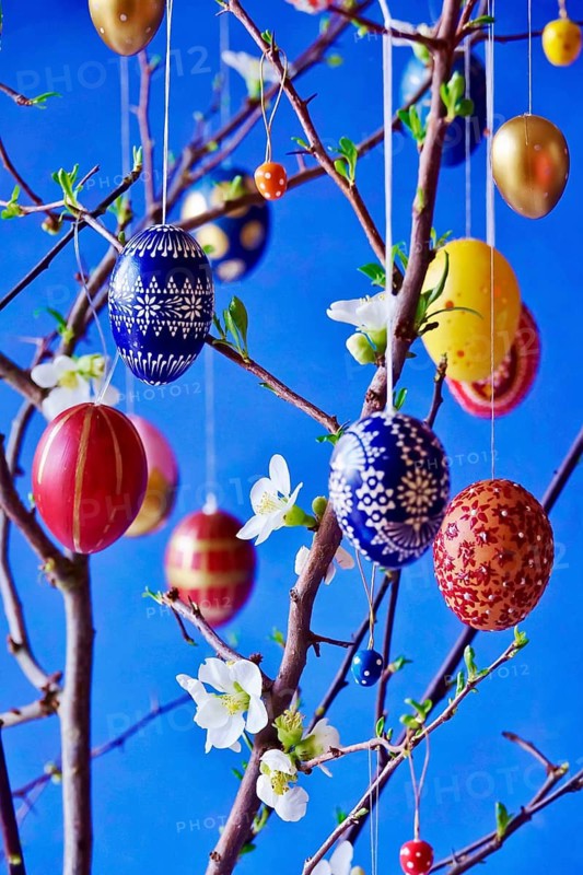 Easter, Easter bouquet with colorful Easter eggs, branches with flowers of an ornamental quince, spring, Germany